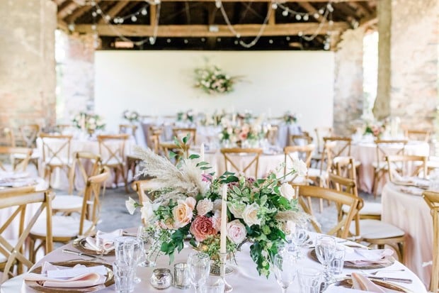 indoor outdoor wedding reception in blush and gold