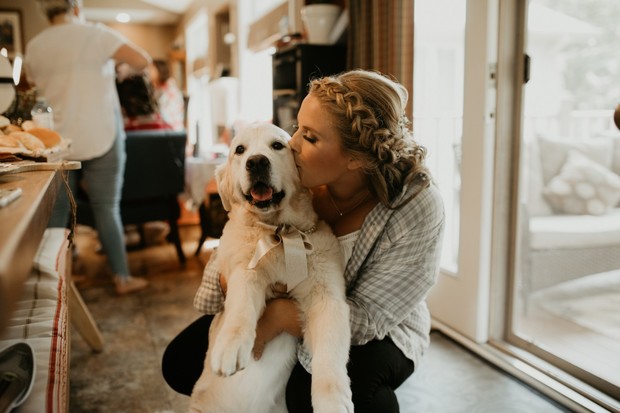 cute bride and wedding dog candid photo
