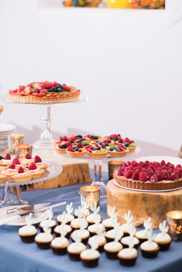 fruit tart and cupcakes dessert table