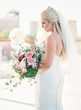 Bride in a wedding dress holding a bouquet of flowers