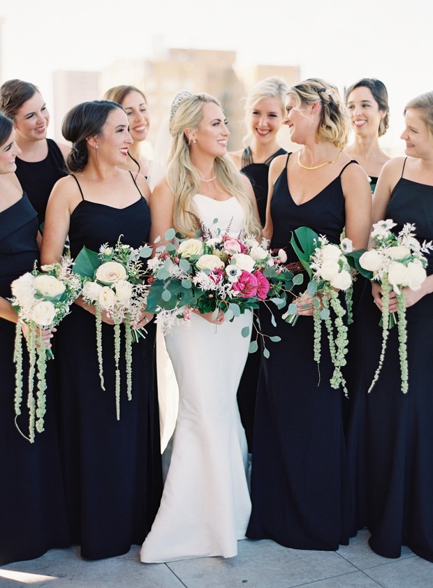 bride and her bridesmaids in black