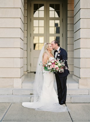 Bride and groom sharing a kiss on their wedding day