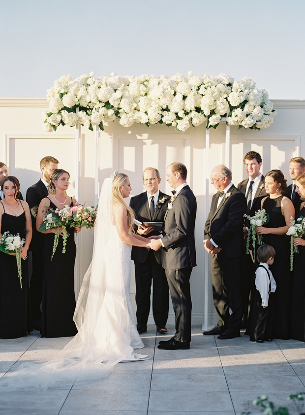 Wedding ceremony vows exchanged with guests present