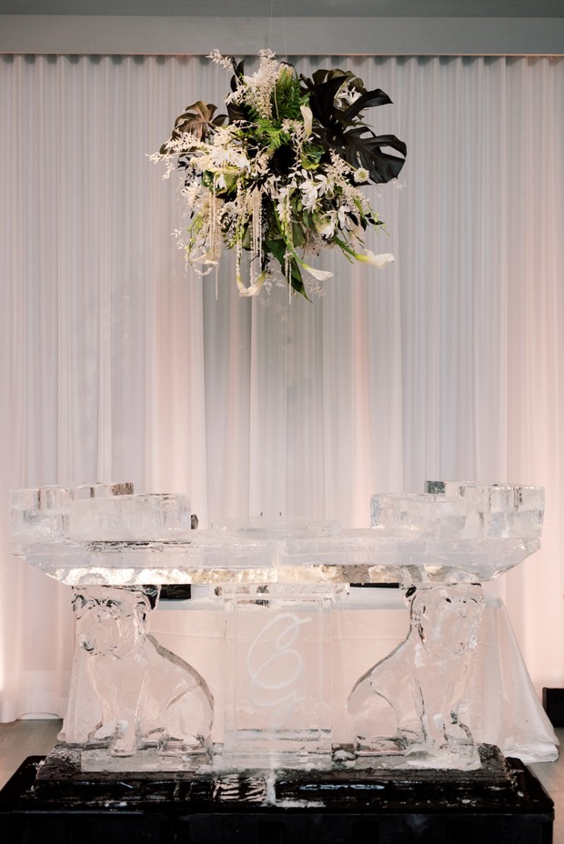 An elegant ice bar with floral decoration, perfect for a wedding
