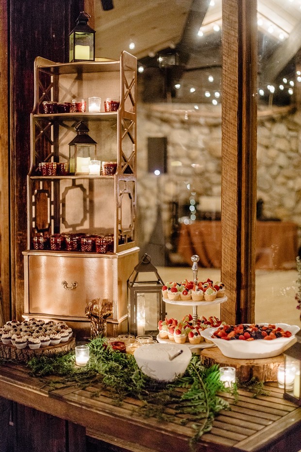 Elegant dessert table with candles and fresh fruit for an event