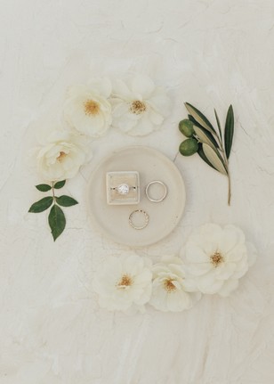 Elegant engagement rings with flowers wedding details