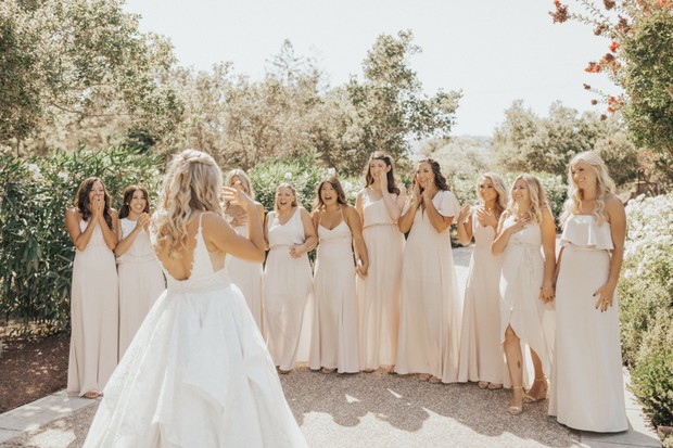 the bridal party in neutral peach dresses