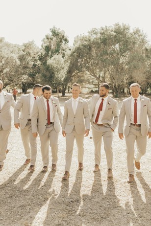 groom and his men in neutral suits