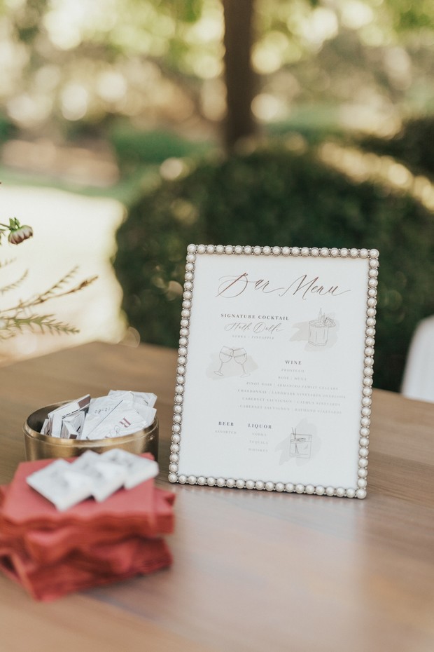Elegant bar menu sign at an outdoor wedding reception