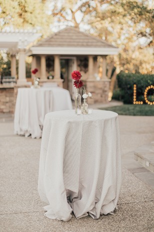 Elegant wedding tables with flower centerpieces outdoors