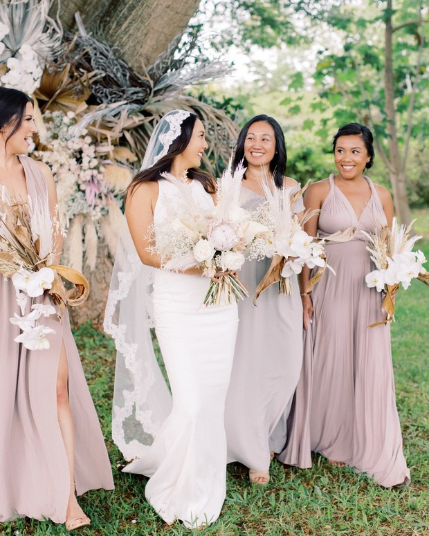 bride and bridesmaids in pretty neutral dresses