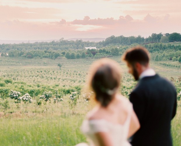 Bride and groom in vineyard wedding landscape sunset