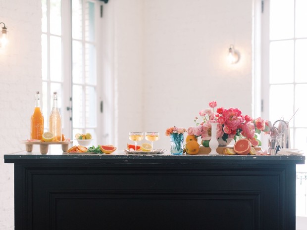 Elegant bar cart with drinks and floral arrangements
