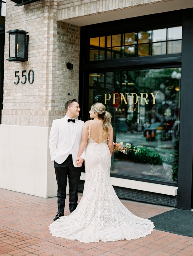 Wedding couple at the Pendry San Diego, holding hands, ready to say I do