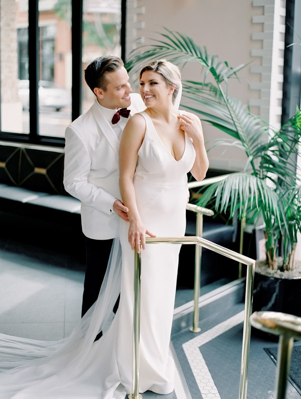 Happy couple on their wedding day, bride and groom smiling at each other