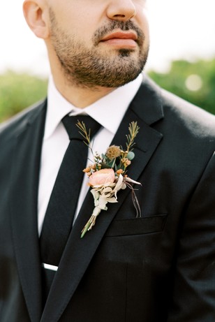 groom in deep grey suit