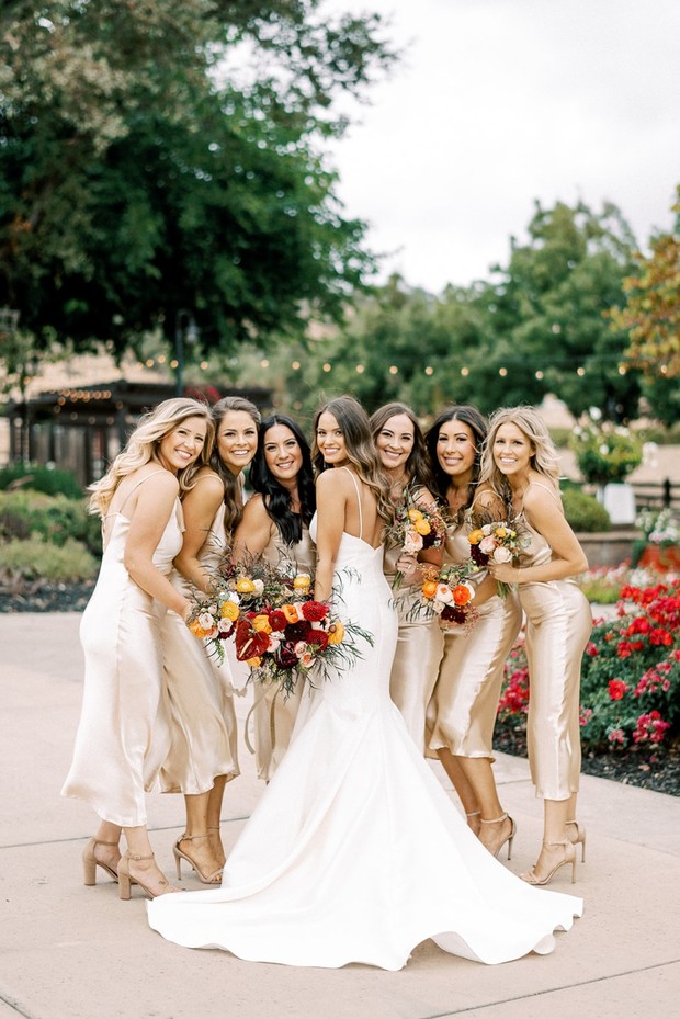 bride and her bridesmaids in gold