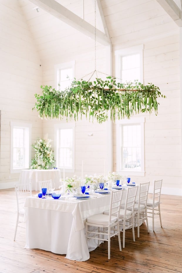 wedding table decor with greenery overhang