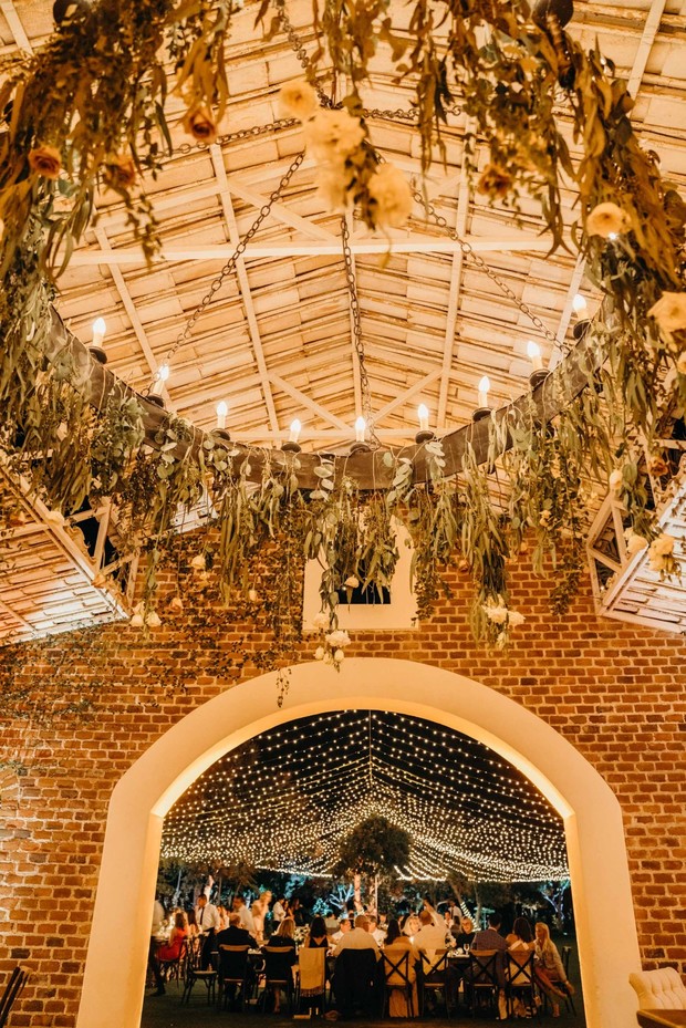 Elegant wedding reception venue with romantic lighting and decor
