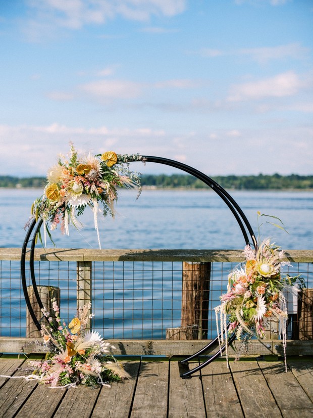 Circle wedding arbor with boho florals