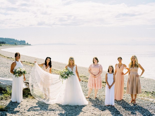 bride and bridesmaids on the beach