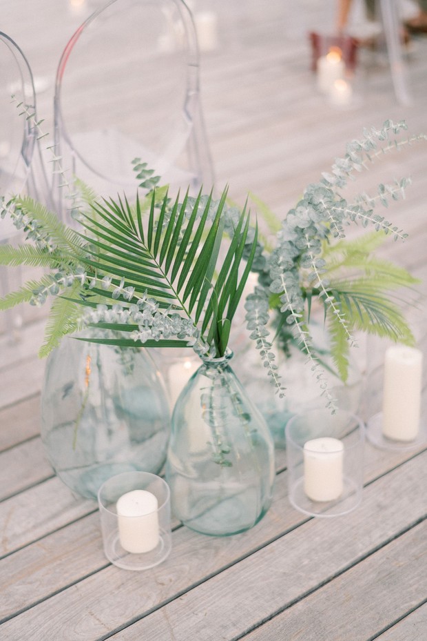 Elegant greenery and candle vases wedding centerpiece decor