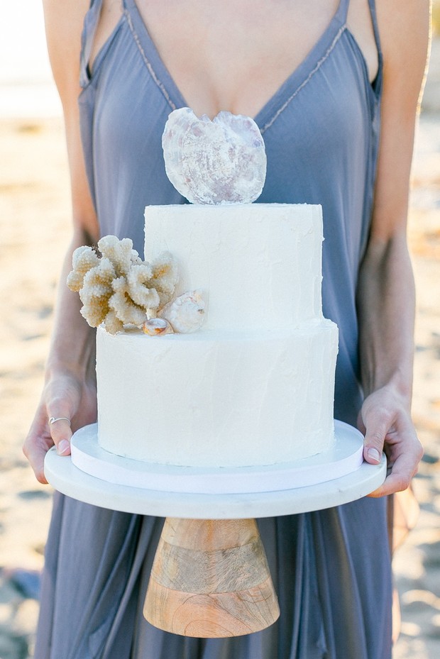 white wedding cake with seashells