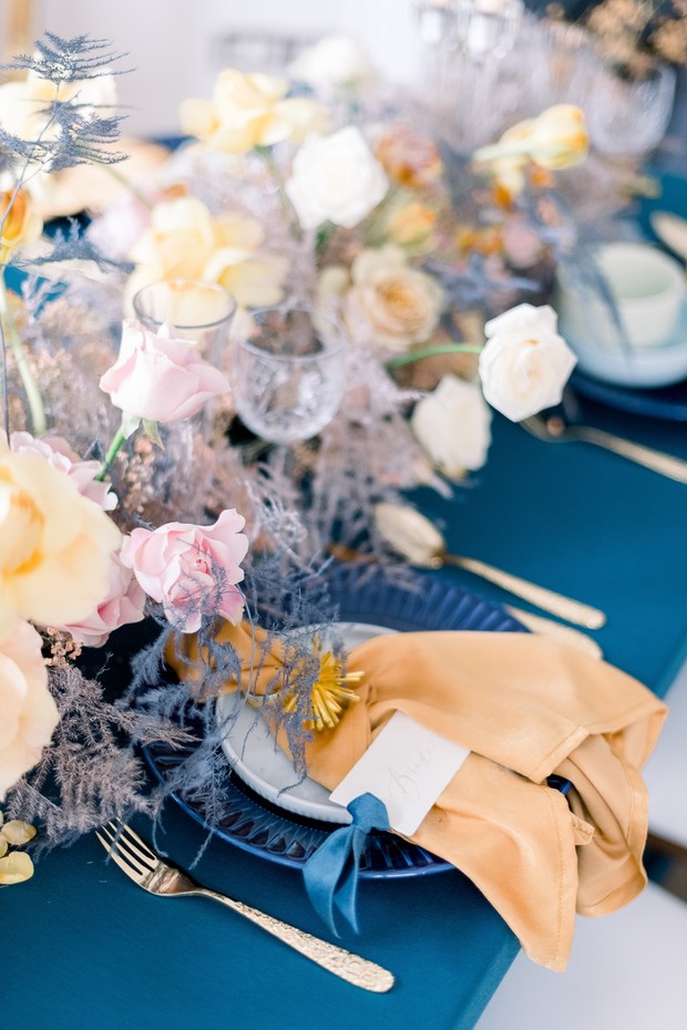 blue and gold wedding place setting