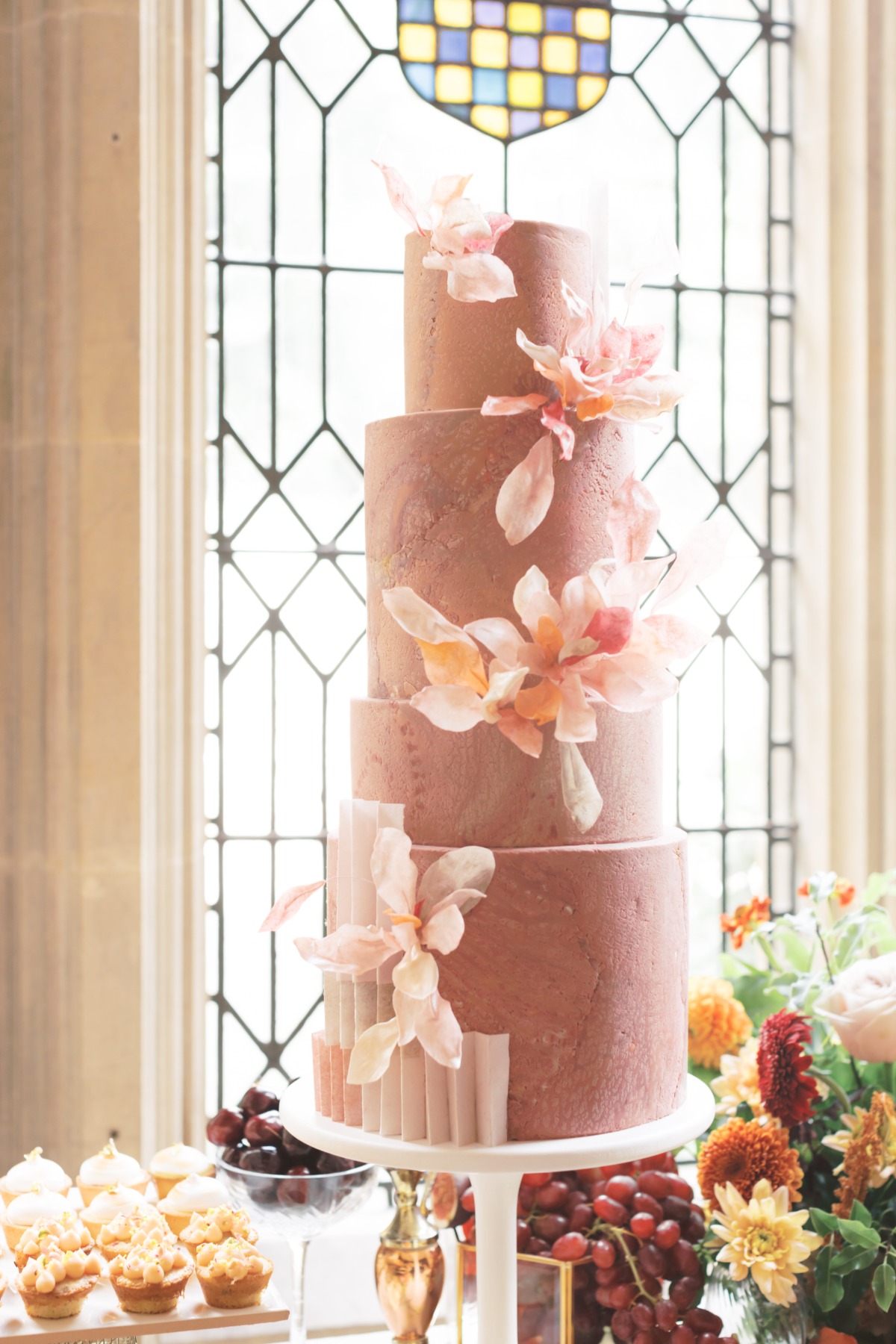 Elegant wedding cake with floral decor and detailed design