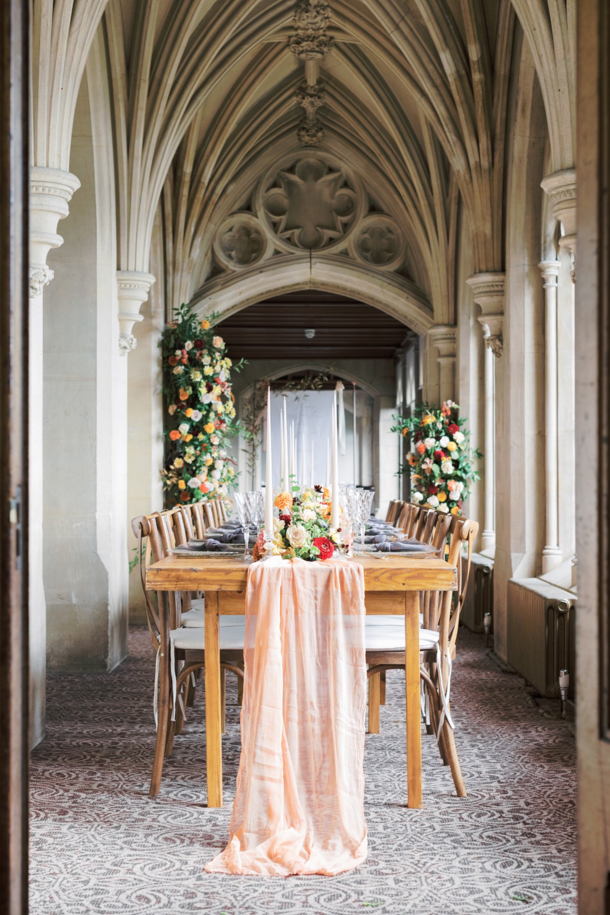 Elegant wedding reception table in gothic hall setting