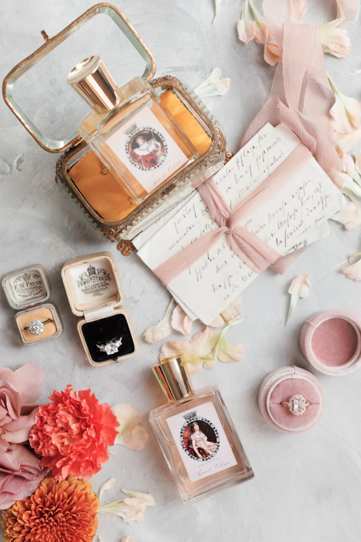 Elegant perfume bottles and rings in vintage boxes