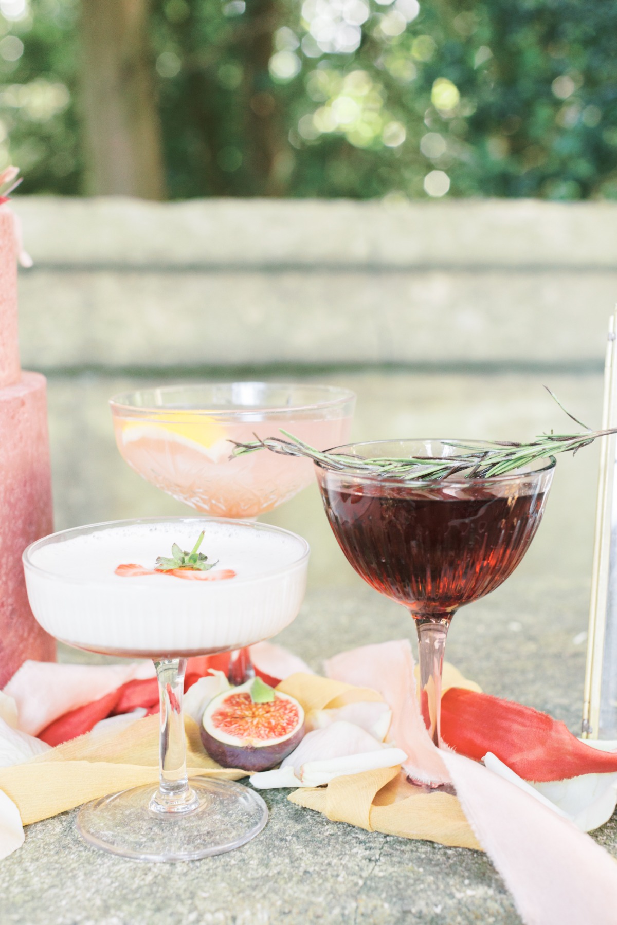 Elegant cocktails with fig garnish and colorful table decor
