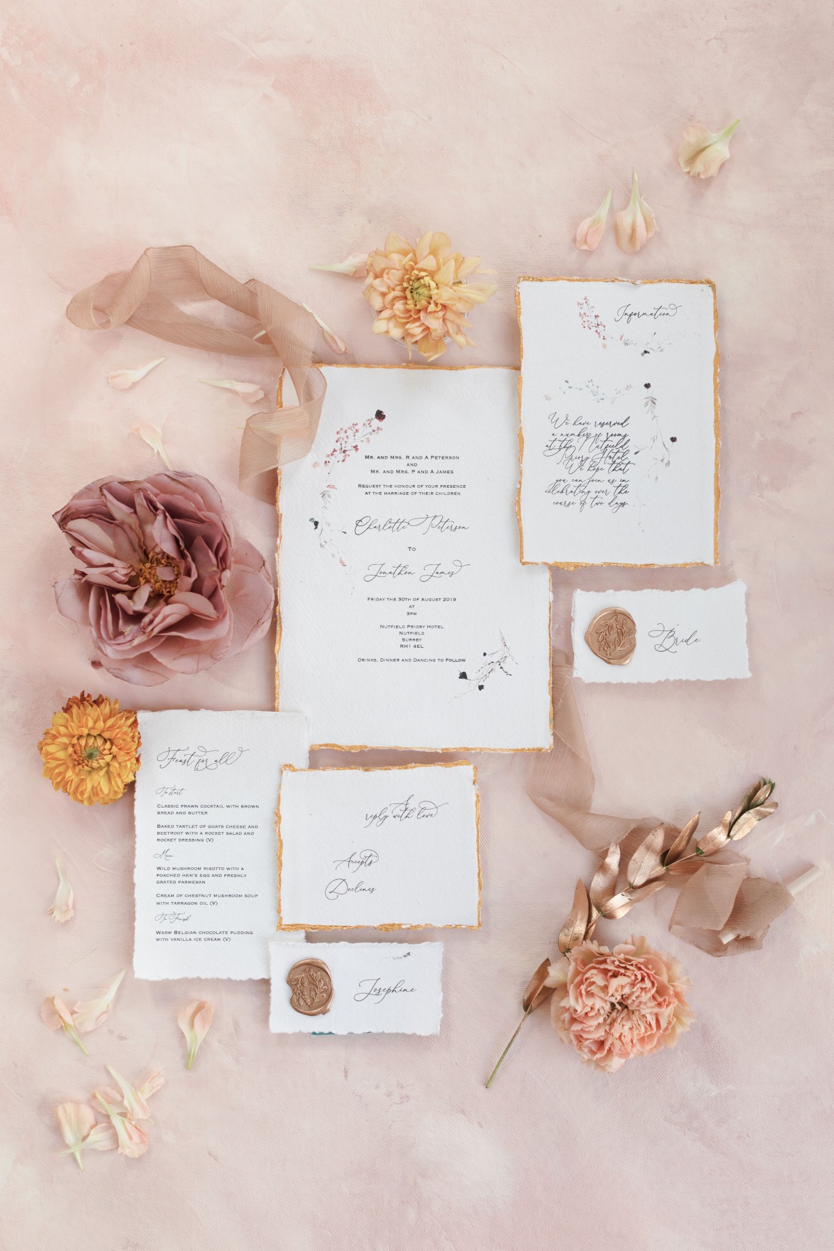 Elegant wedding invitation suite with floral accents