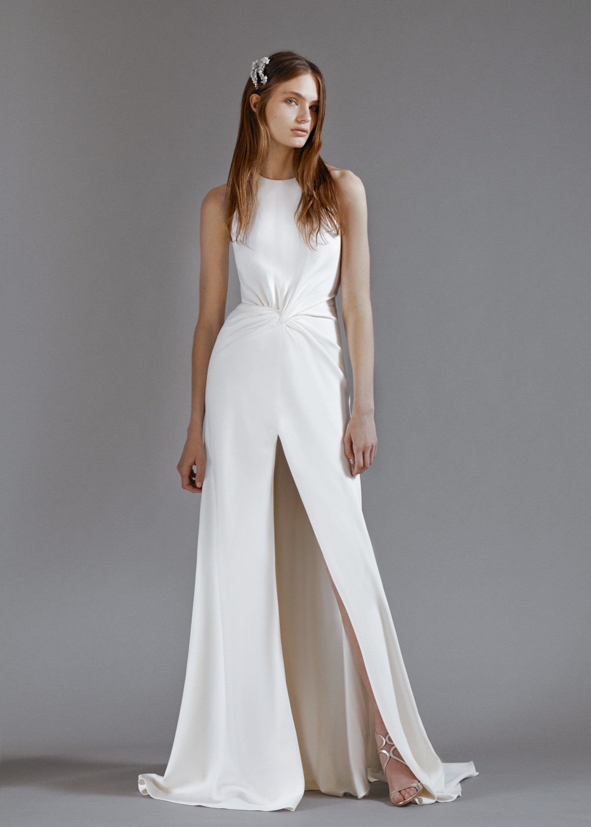 Elegant white dress with a high slit for a modern bride