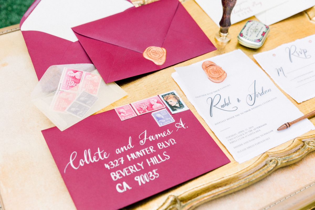 Elegant wedding invitations in burgundy with wax seals