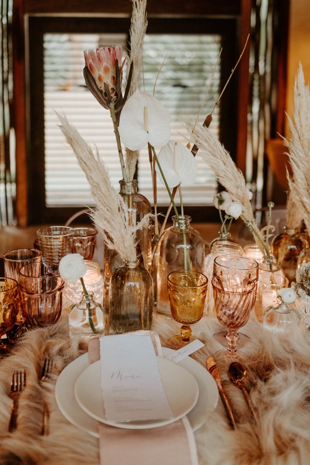 Boho chic table setting with pampas grass and protea