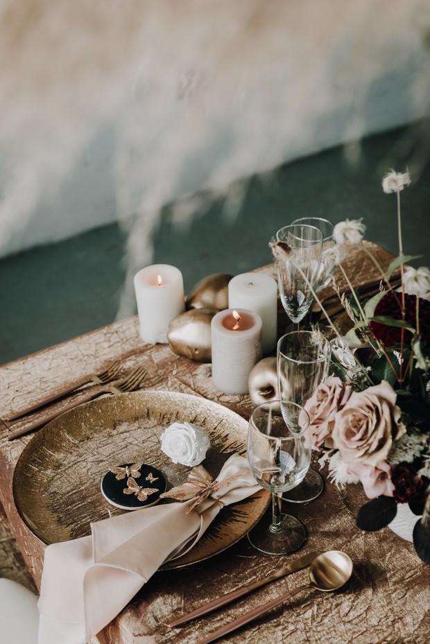 Elegant table setting with gold accents and floral decor
