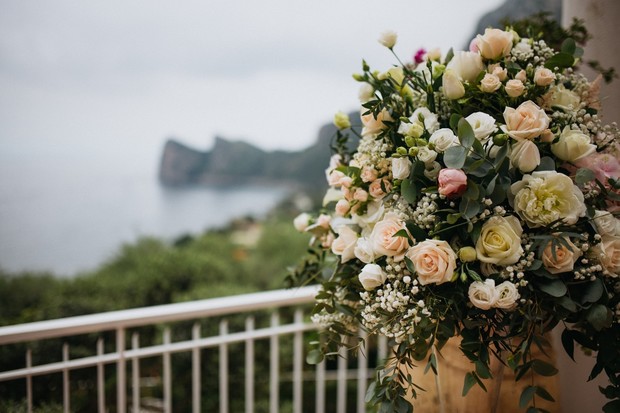 Elegant floral arrangement overlooking scenic coastal landscape