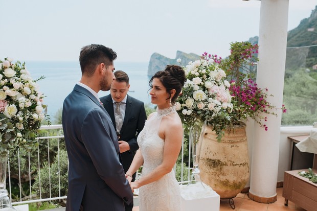 Bride and groom at outdoor seaside wedding ceremony
