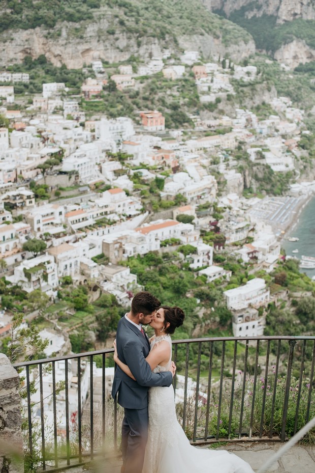 Bride and groom kissing in Positano Italy wedding day