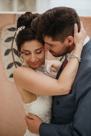 Bride and groom embrace intimately on their wedding day, full of love