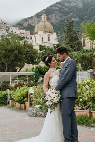 Positano Italy wedding couple with church backdrop