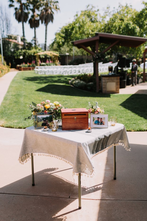 Outdoor wedding table with photos and wooden card box