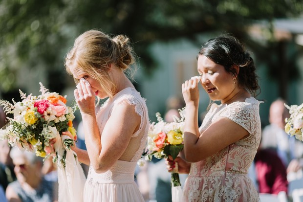 Bridesmaids crying happy tears at outdoor wedding event