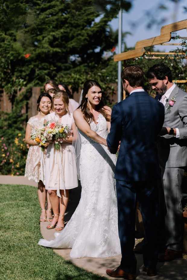 Bride and groom exchanging vows at outdoor wedding