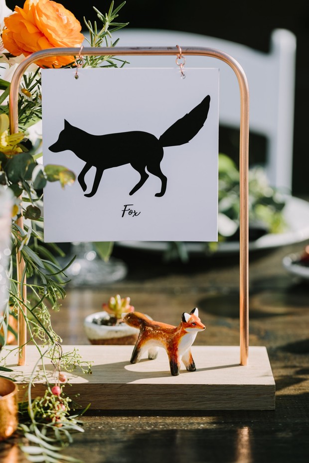 Fox themed wedding table decor with silhouette and figurine