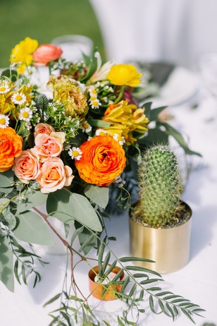 Colorful floral centerpiece with cactus accent decor