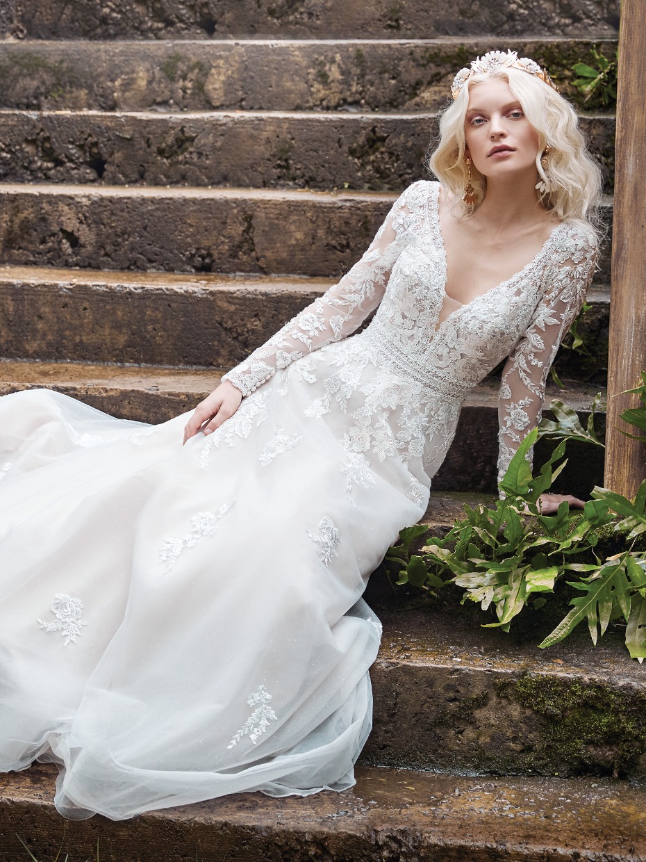 Bride in long sleeved lace wedding dress and tiara