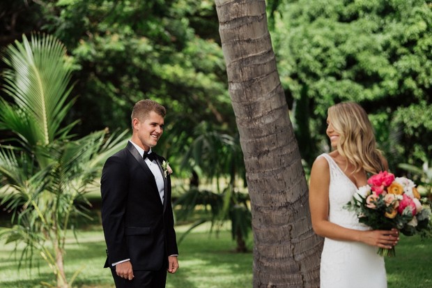 Bride and groom first look at outdoor wedding venue