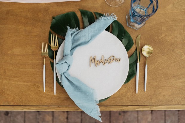 Elegant place setting with Madison name card and blue napkin